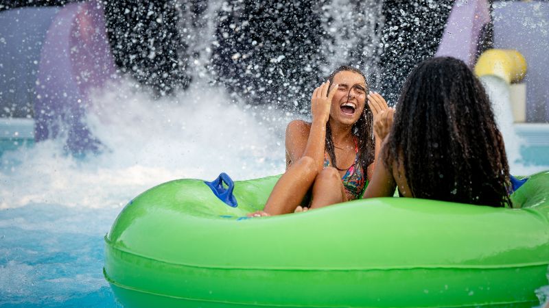 Girls on tube after a thrilling ride at Wet n Wild 